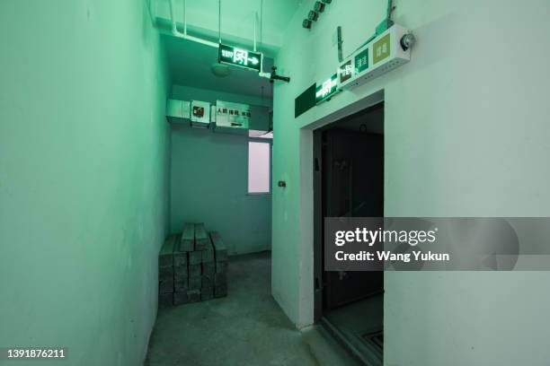 dark underground warehouse - air raid shelter stock pictures, royalty-free photos & images