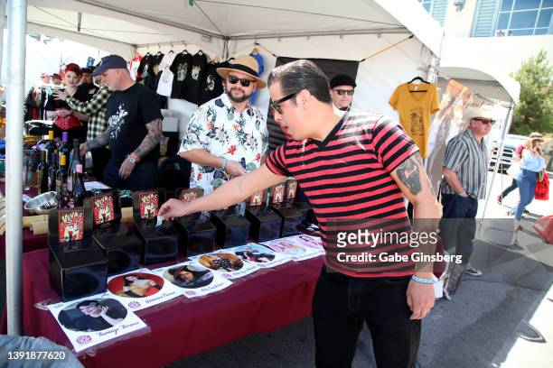 An attendee casts his vote for the 2022 Queen of the Car Show pageant during the car show at the 25th anniversary of the Viva Las Vegas Rockabilly...