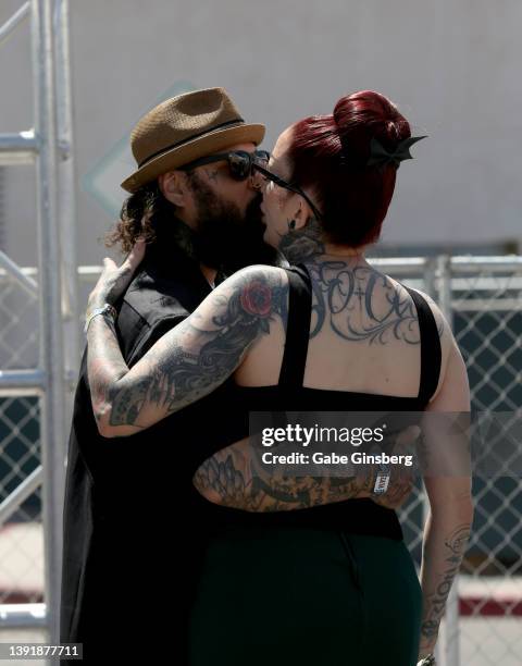 Jay Rivera and Ricky Rivera of Texas kiss after they had their wedding renewal ceremony performed by an Elvis Presley impersonator during the car...