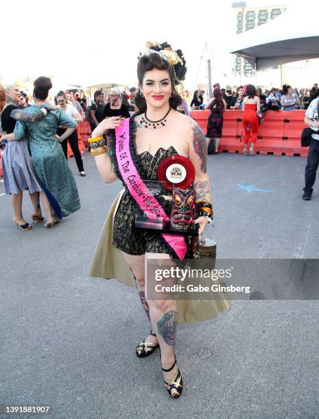 The newly crowned 2022 Viva Las Vegas Queen of the Carshow Claudi Rox poses during the car show at the 25th anniversary of the Viva Las Vegas...