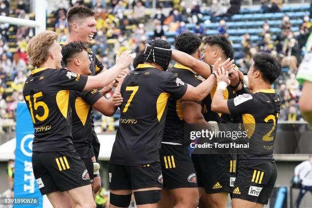 Taiga Ozaki of Tokyo Suntory Sungoliath celebrates with his teammates after scoring a try during the NTT Japan Rugby League One match between Tokyo...