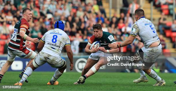 Freddie Steward of Leicester Tigers takes on Fritz Lee and Miles Amatosero during the Heineken Champions Cup Round of 16 Leg Two match between...