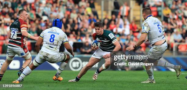 Freddie Steward of Leicester Tigers takes on Fritz Lee and Miles Amatosero during the Heineken Champions Cup Round of 16 Leg Two match between...