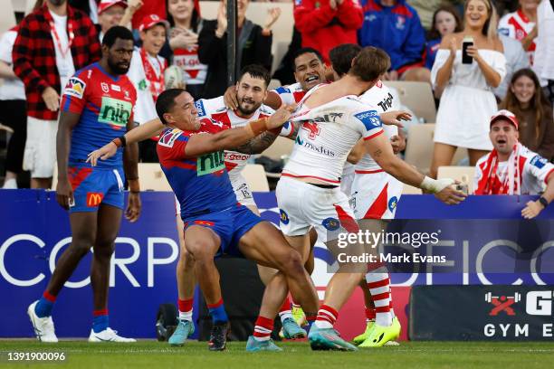 Tyson Frizell of the Knights slams Zac Lomax of the Dragons to the ground after a Dragons try during the round six NRL match between the St George...