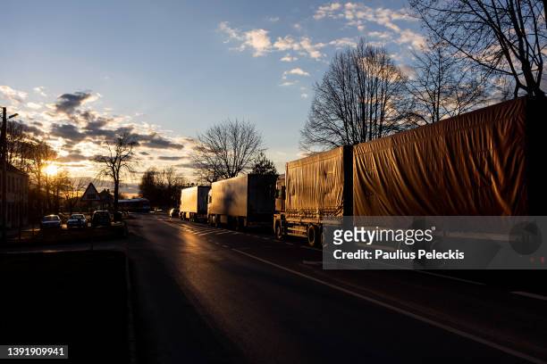 Trucks stand in line while on route towards the border crossing point on April 16, 2022 in Kybartai, Lithuania. Russia's Kaliningrad exclave, on the...