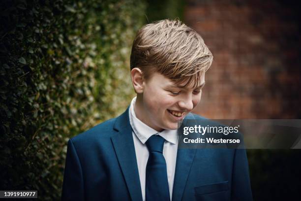 teenager dressed for his communion - christian spirituality stock pictures, royalty-free photos & images