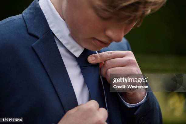 teenager dressed for his communion - black suit stock pictures, royalty-free photos & images