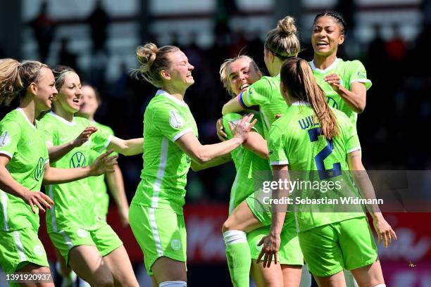 Jill Roord of VfL Wolfsburg celebrates with teammates after scoring their sides first goal during the Women's DFB Cup semi final match between Bayern...