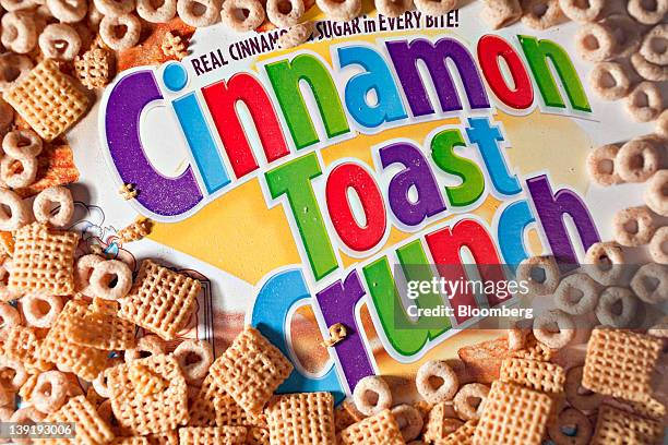 Box of General Mills Inc. Cinnamon Toast Crunch cereal is surrounded by Cheerios and Corn Chex in this arranged photograph in Washington, D.C., U.S.,...