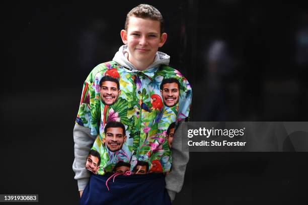Young Newcastle United fan wears a shirt featuring the face of Bruno Guimaraes prior to the Premier League match between Newcastle United and...