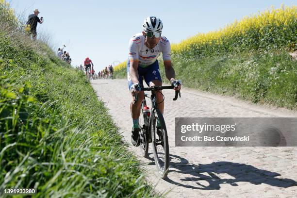 10competes passing through a cobblestones sector during the 119th Paris-Roubaix 2022 - Men's Elite a 257,2km one day race from Compiègne to Roubaix /...