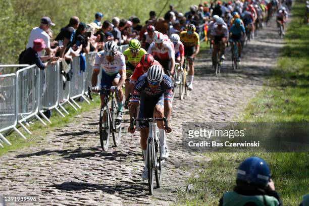 Maciej Bodnar of Poland and Team Total Energies and Mathieu Van Der Poel of Netherlands and Team Alpecin-Fenix compete passing through La Trouée...