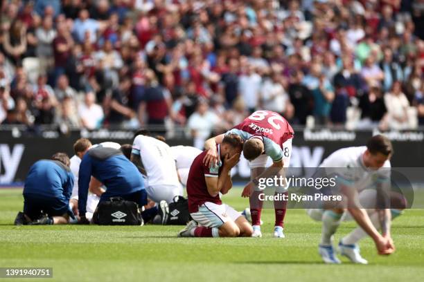 Nikola Vlasic of West Ham United reacts after clashing with Ashley Westwood of Burnley during the Premier League match between West Ham United and...