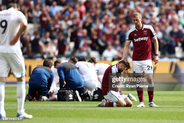 Nikola Vlasic of West Ham United reacts after clashing with Ashley Westwood of Burnley during the Premier League match between West Ham United and...