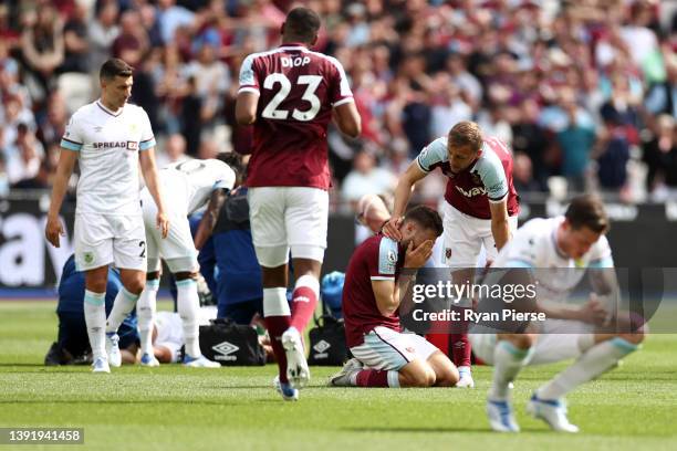 Nikola Vlasic of West Ham United reacts after clashing with Ashley Westwood of Burnley during the Premier League match between West Ham United and...