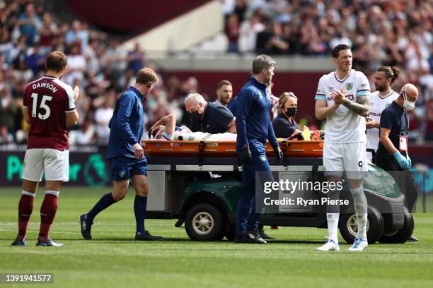 Ashley Westwood of Burnley is taken off on a stretcher during the Premier League match between West Ham United and Burnley at London Stadium on April...