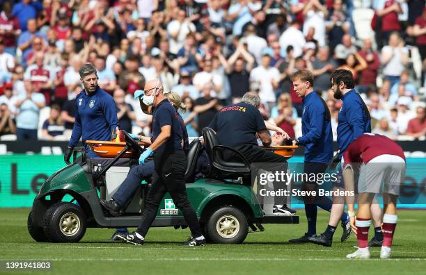 Ashley Westwood of Burnley is taken off on a stretcher during the Premier League match between West Ham United and Burnley at London Stadium on April...