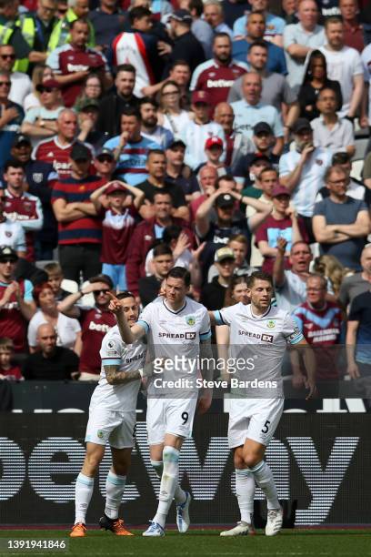 Wout Weghorst of Burnley celebrates with team mates Josh Brownhill and James Tarkowski after scoring their sides first goal during the Premier League...