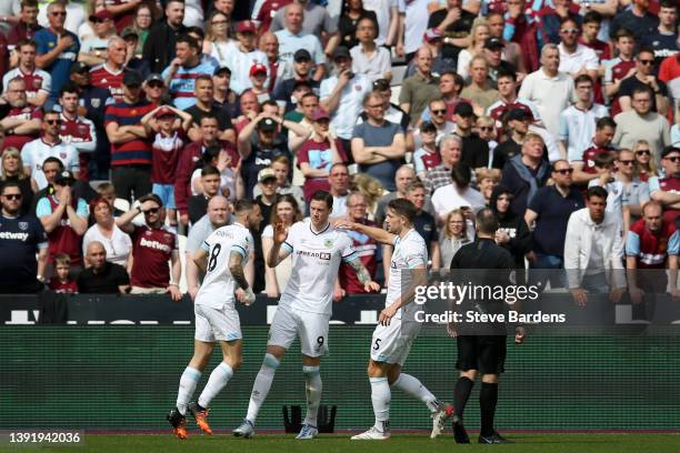 Wout Weghorst of Burnley celebrates with team mates Josh Brownhill and James Tarkowski after scoring their sides first goal during the Premier League...