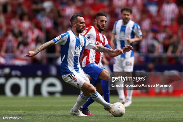 Sergi Darder of Espanyol is challenged by Koke of Atletico Madrid during the LaLiga Santander match between Club Atletico de Madrid and RCD Espanyol...