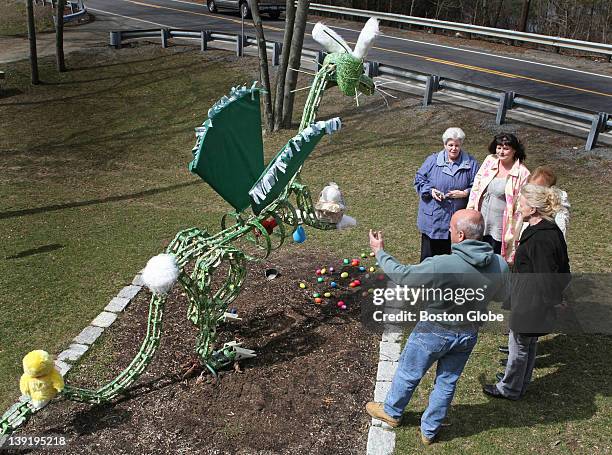 Firefighter Chuck Nudd, below, explaining to passersby, constructed Draco the Dragon out of metal scraps and junk parts about three years ago. The...