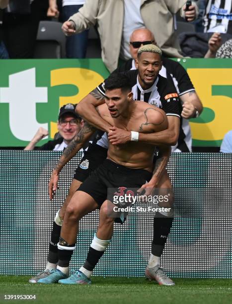 Bruno Guimaraes celebrates with Joelinton of Newcastle United after scoring their team's second goal during the Premier League match between...