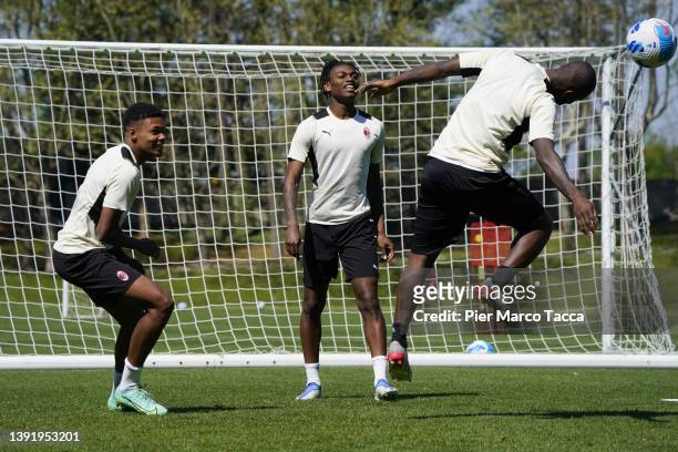 Emil Roback, Rafael Leao and Franck Kessie in action during an AC Milan training session at Milanello on April 17, 2022 in Cairate, Italy.