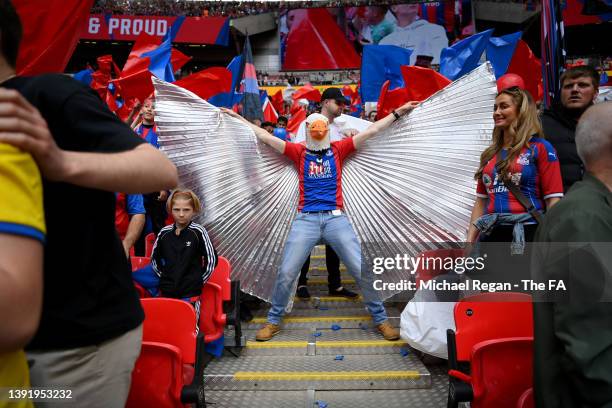 Crystal Palace fan wearing an Eagle mask looks on prior to The FA Cup Semi-Final match between Chelsea and Crystal Palace at Wembley Stadium on April...