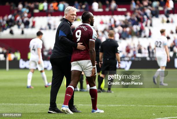 David Moyes, Manager of West Ham United interacts with Michail Antonio of West Ham United after the Premier League match between West Ham United and...