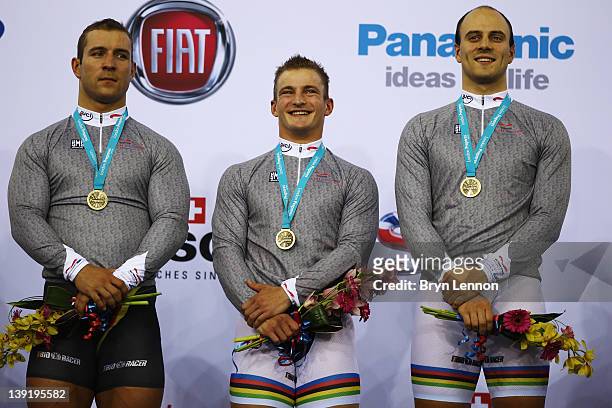 Rene Enders, Robert Forstemann and Maximilian Levy of Germany receive their gold medals for winning the Men's Team Sprint during the UCI Track...