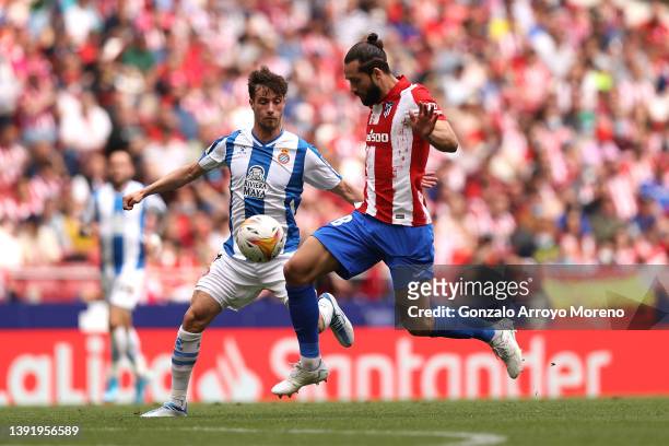 Felipe of Atletico Madrid controls the ball whilst under pressure from Javi Puado of Espanyol during the LaLiga Santander match between Club Atletico...