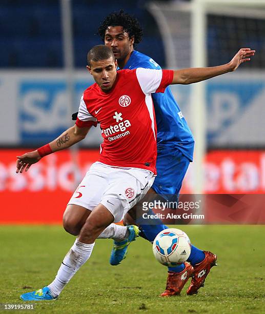 Mohamed Zidan of Mainz is challenged by Marvin Compper of Hoffenheimduring the Bundesliga match between 1899 Hoffenheim and FSV Mainz 05 at...