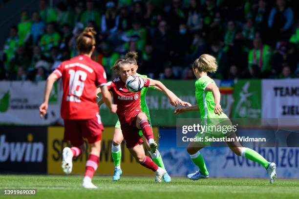 Klara Bühl of FC Bayern München and Felicitas Rauch of VfL Wolfsburg compete for the ball during the Women's DFB Cup semi final match between Bayern...