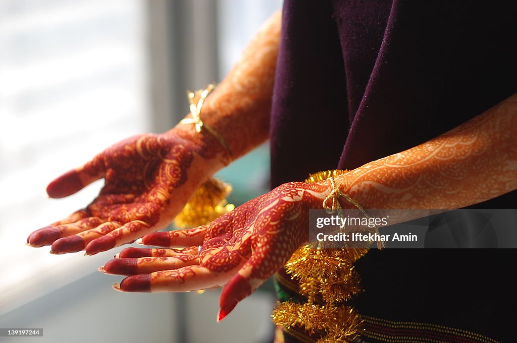 Hands with henna tattoo