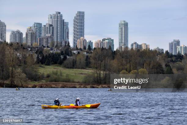 kayaking  on the deer lake in spring time, bc,  canada - bc commercial fishing boats stock pictures, royalty-free photos & images
