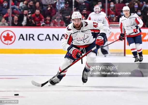 Tom Wilson of the Washington Capitals skates after the puck against the Montreal Canadiens during the third period at Centre Bell on April 16, 2022...