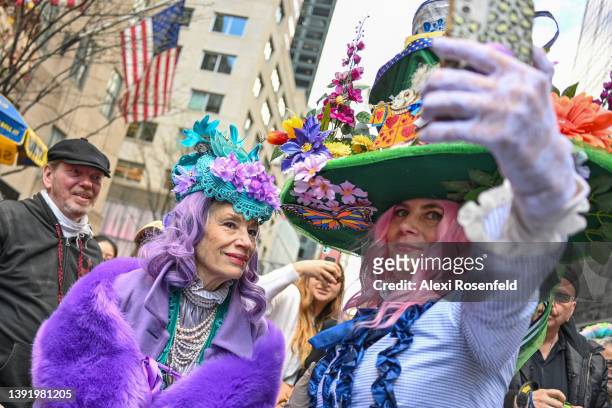 People wearing costumes take a selfie while participating in the annual Easter Parade and Bonnet Festival along Fifth Avenue on Easter Sunday on...