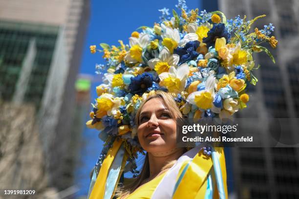 Larissa Larina, originally from Ukraine, wears a Ukrainian flag colored floral headpiece at the annual Easter Parade and Bonnet Festival along Fifth...