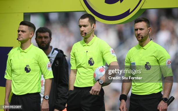 Referee Jarred Gillett and assistants look on before the Premier League match between Newcastle United and Leicester City at St. James Park on April...