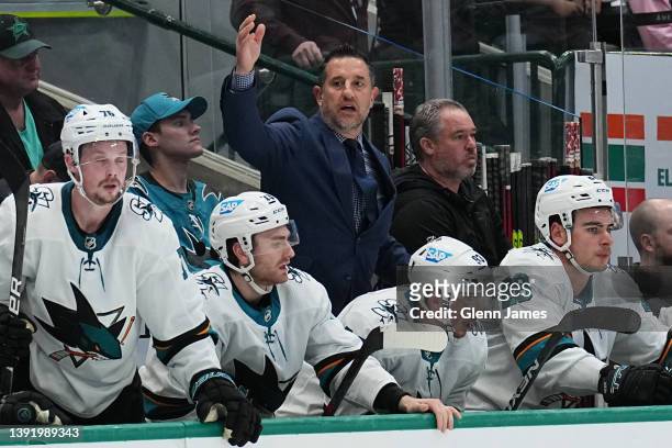 Bob Boughner of the San Jose Sharks calls his goalie back to the bench against the Dallas Stars at the American Airlines Center on April 16, 2022 in...