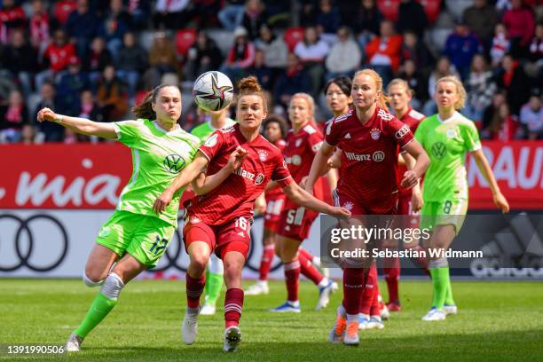 Ewa Pajor of VfL Wolfsburg and Lina Magull of FC Bayern München compete for the ball during the Women's DFB Cup semi final match between Bayern...