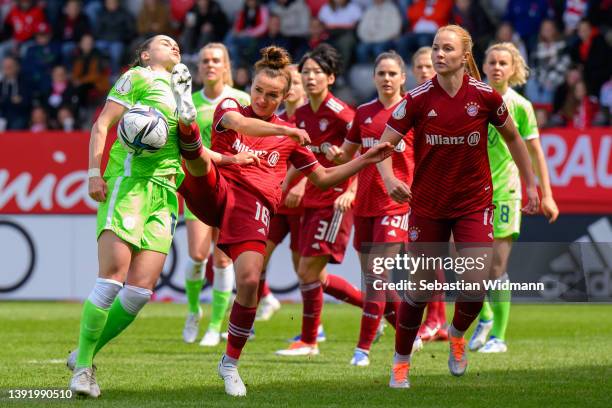Ewa Pajor of VfL Wolfsburg and Lina Magull of FC Bayern München compete for the ball during the Women's DFB Cup semi final match between Bayern...