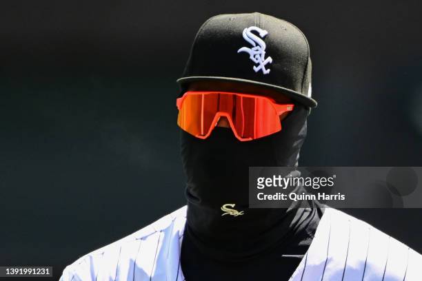 Eloy Jimenez of the Chicago White Sox bundles up while warming up before the game against the Tampa Bay Rays at Guaranteed Rate Field on April 17,...