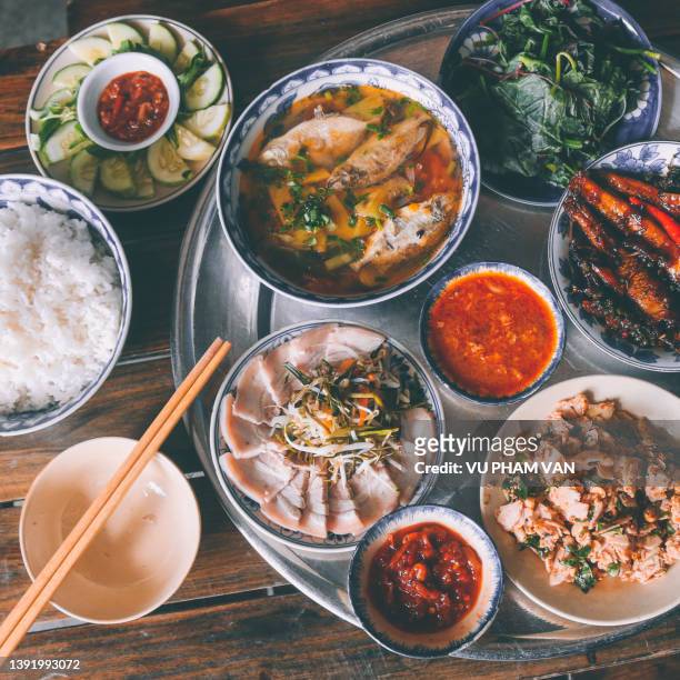 vietnamese authentic meal at home for lunch in hue city, vietnam - vietnamese street food stock-fotos und bilder
