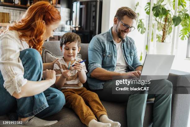 father working from home - browsing the internet stock pictures, royalty-free photos & images