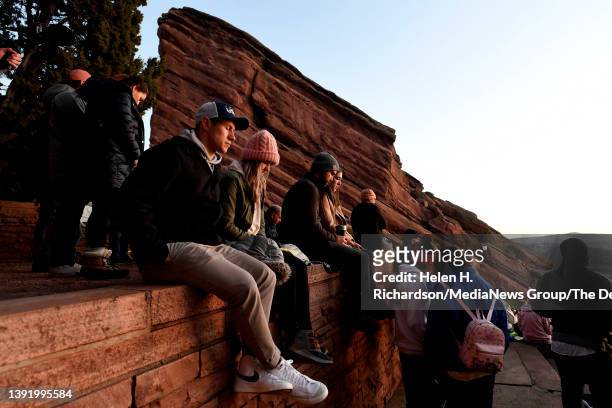 People close their eyes in a moment of prayer during the 75th annual Easter Sunrise service at Red Rocks Park and Amphitheatre on April 17, 2022 in...