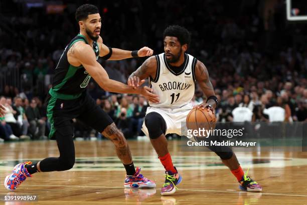 Jayson Tatum of the Boston Celtics defends Kyrie Irving of the Brooklyn Nets during the first quarter of Round 1 Game 1 of the 2022 NBA Eastern...