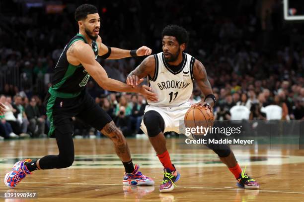 Jayson Tatum of the Boston Celtics defends Kyrie Irving of the Brooklyn Nets during the first quarter of Round 1 Game 1 of the 2022 NBA Eastern...