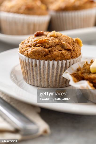 whole grain banana walnut muffin with melted butter - muffin stock pictures, royalty-free photos & images