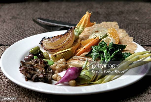 At Blue Room in Cambridge, a vegetable antipasto features flatbread, fennel and orange salad, glazed baby carrots, squash blossom, roasted vidalia...